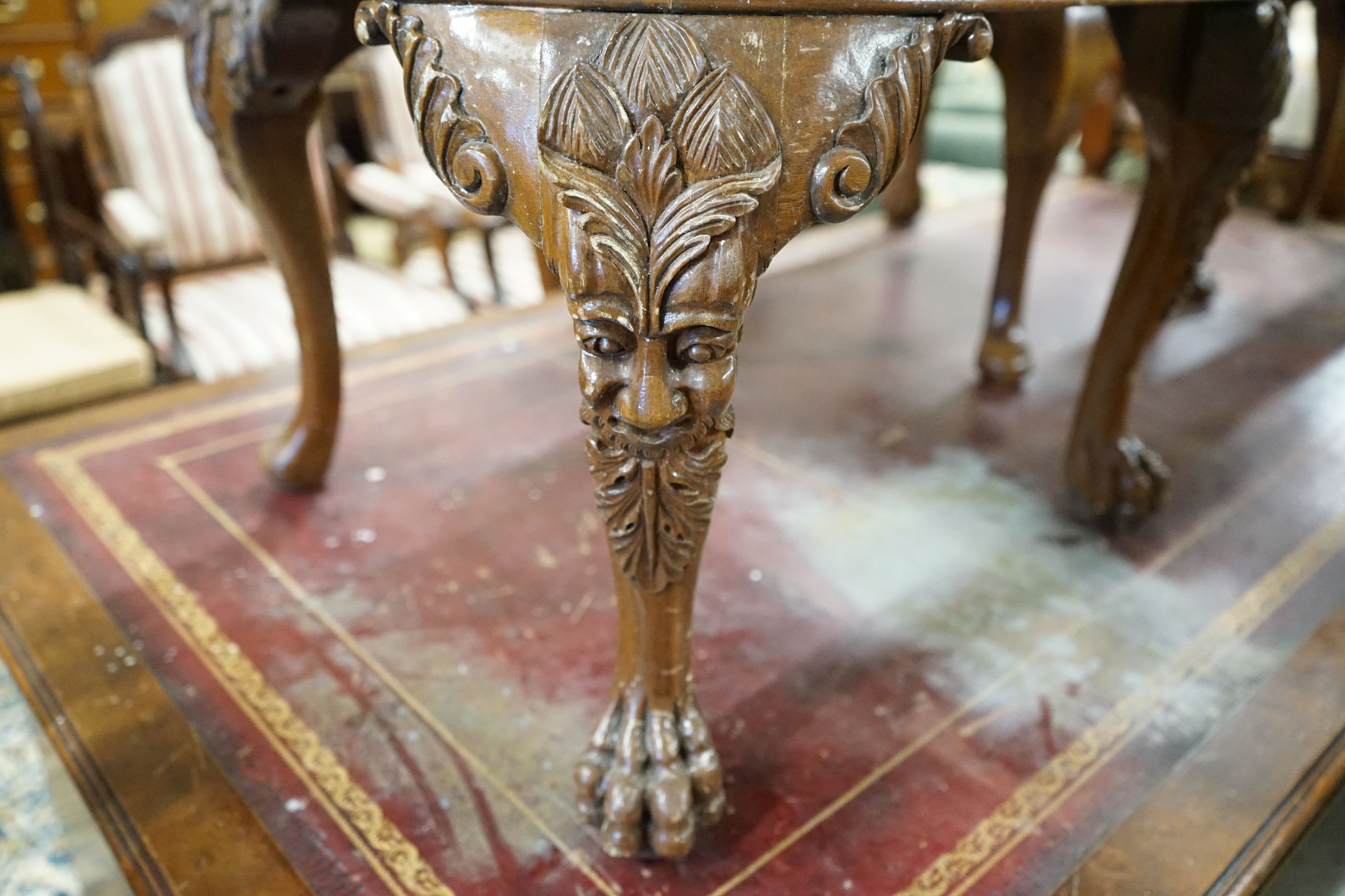 A set of twelve George II style carved walnut dining chairs, two with arms